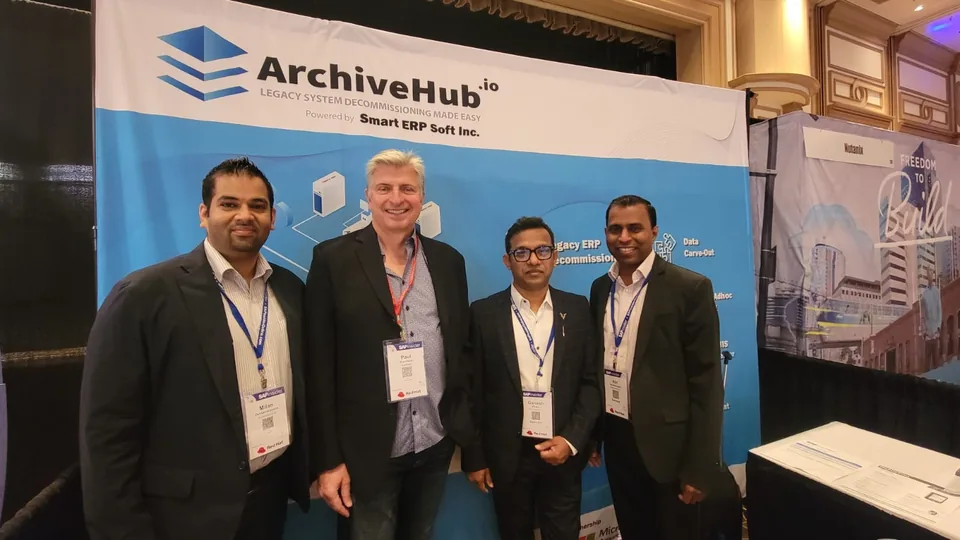 ArchiveHub team with a guest at the SAPinsider Las Vegas 2022 booth